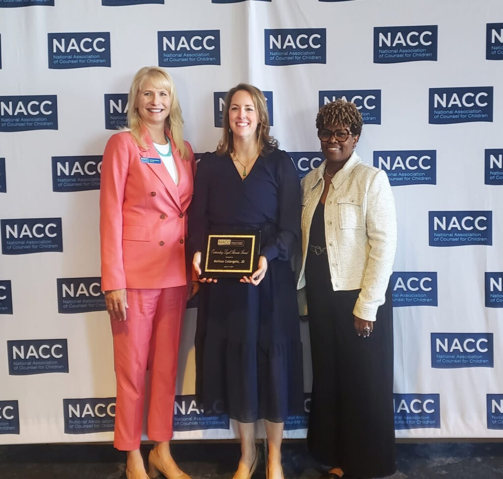 Appellate Director Melissa Colangelo receives National Outstanding Legal Advocate award from NACC Chief Executive Officer Kim Dvorchak (L) and NACC Board President Dawne Mitchell (R).