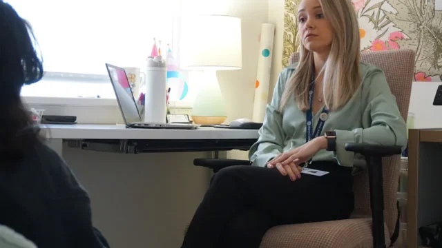 Briana D'Accurzio, a mental health therapist, meets with a student at a D.C. school.