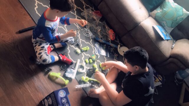 Photo of Elmer playing with his activity kit