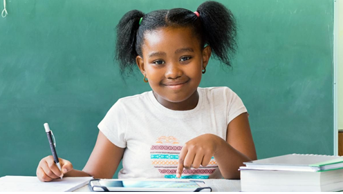 Stock photo of young girl working on schoolwork.
