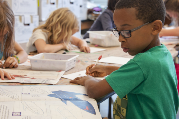Boy in a classroom doing work